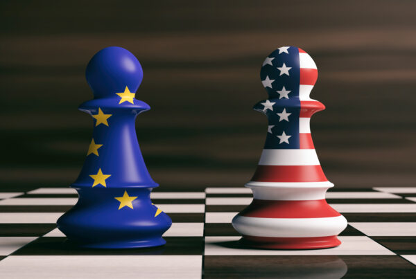 USA and European Union flags on chess pawns on a chessboard. 3d