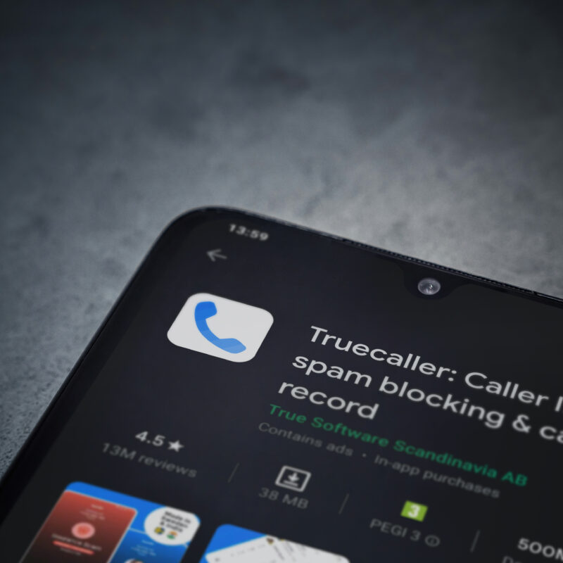 Truecaller app play store page on the display of a black mobile